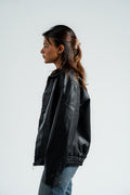 Person wearing a black leather jacket on a white background