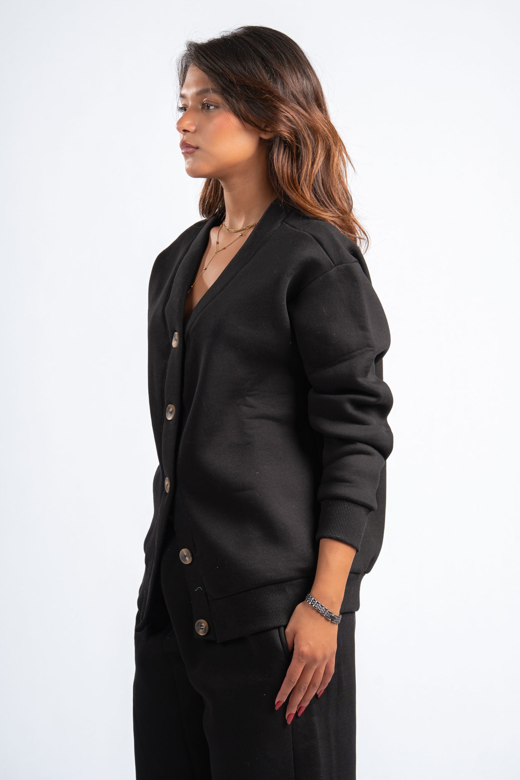 Woman wearing a black blazer against a white background
