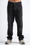 Person wearing black jeans on a white background