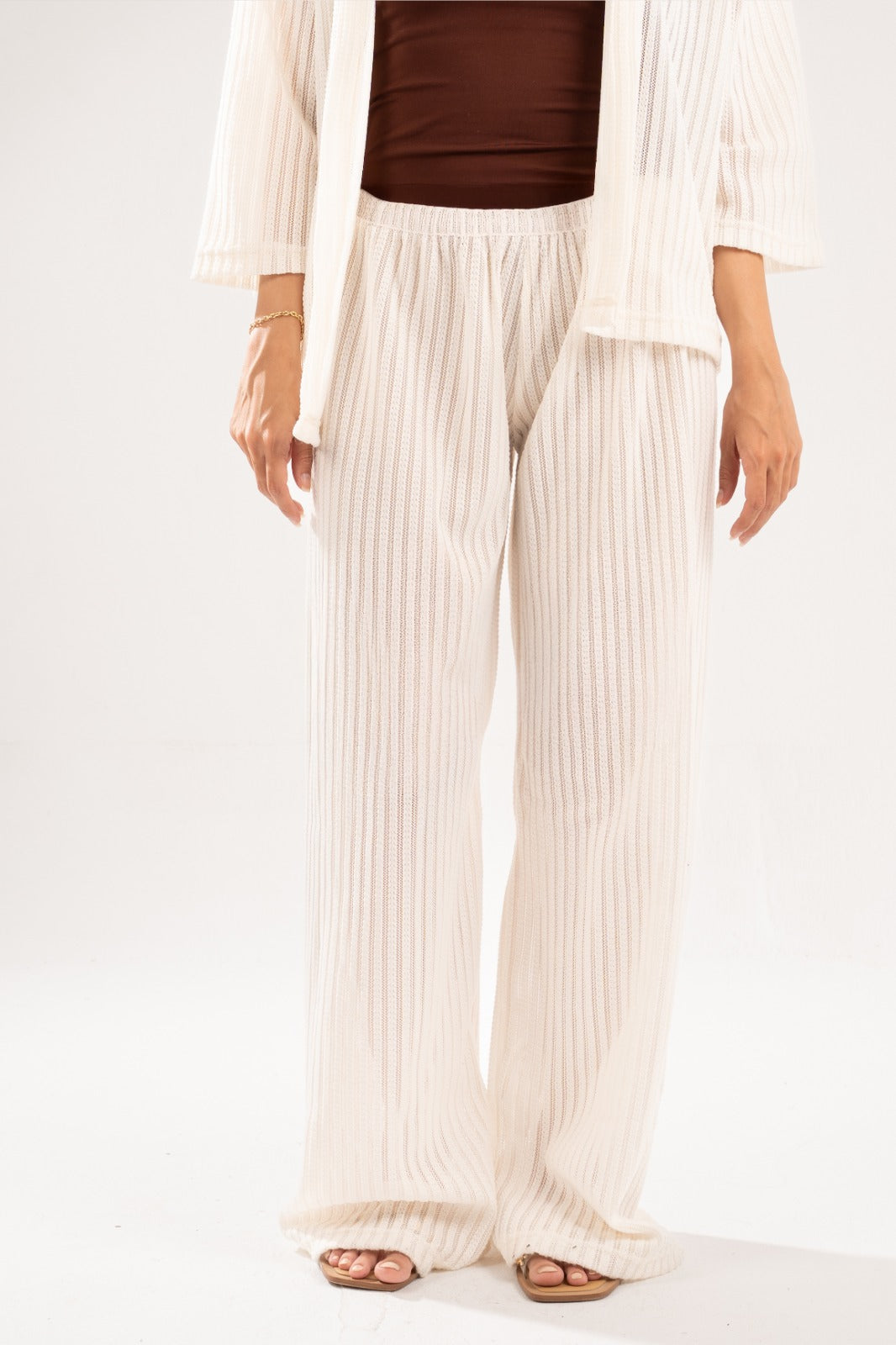 OFF-WHITE SEMI SHEER KNITTED PANTS