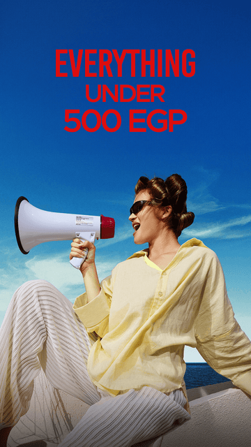 A woman in a pale yellow top and striped pants sits against a blue sky background, holding a white and red megaphone. Large red text at the top reads 'EVERYTHING UNDER 500 EGP'.
