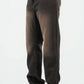 Dark jeans worn by a person on a white background