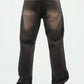 Dark jeans worn by a person on a white background