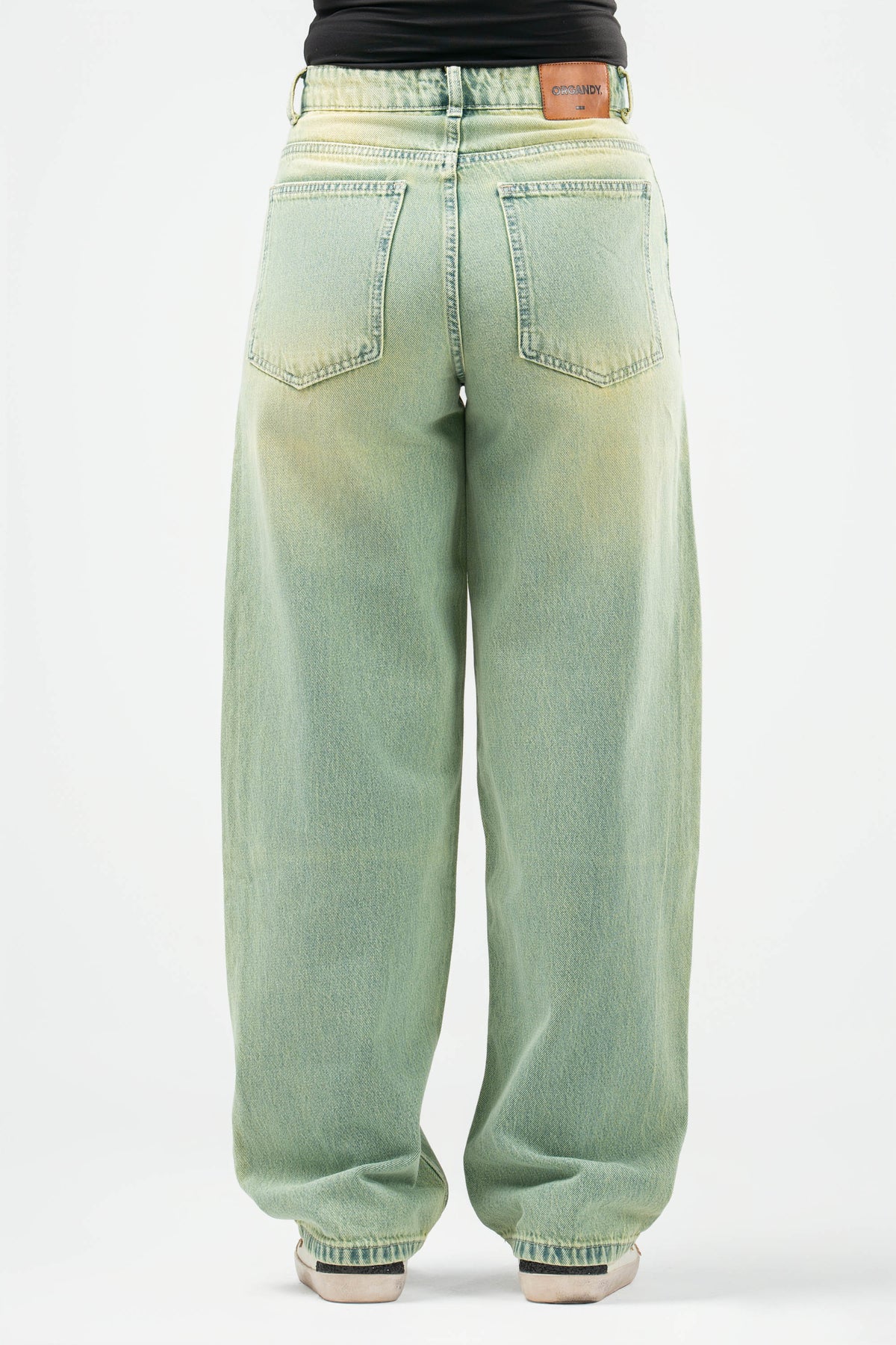 Light green jeans on a white background