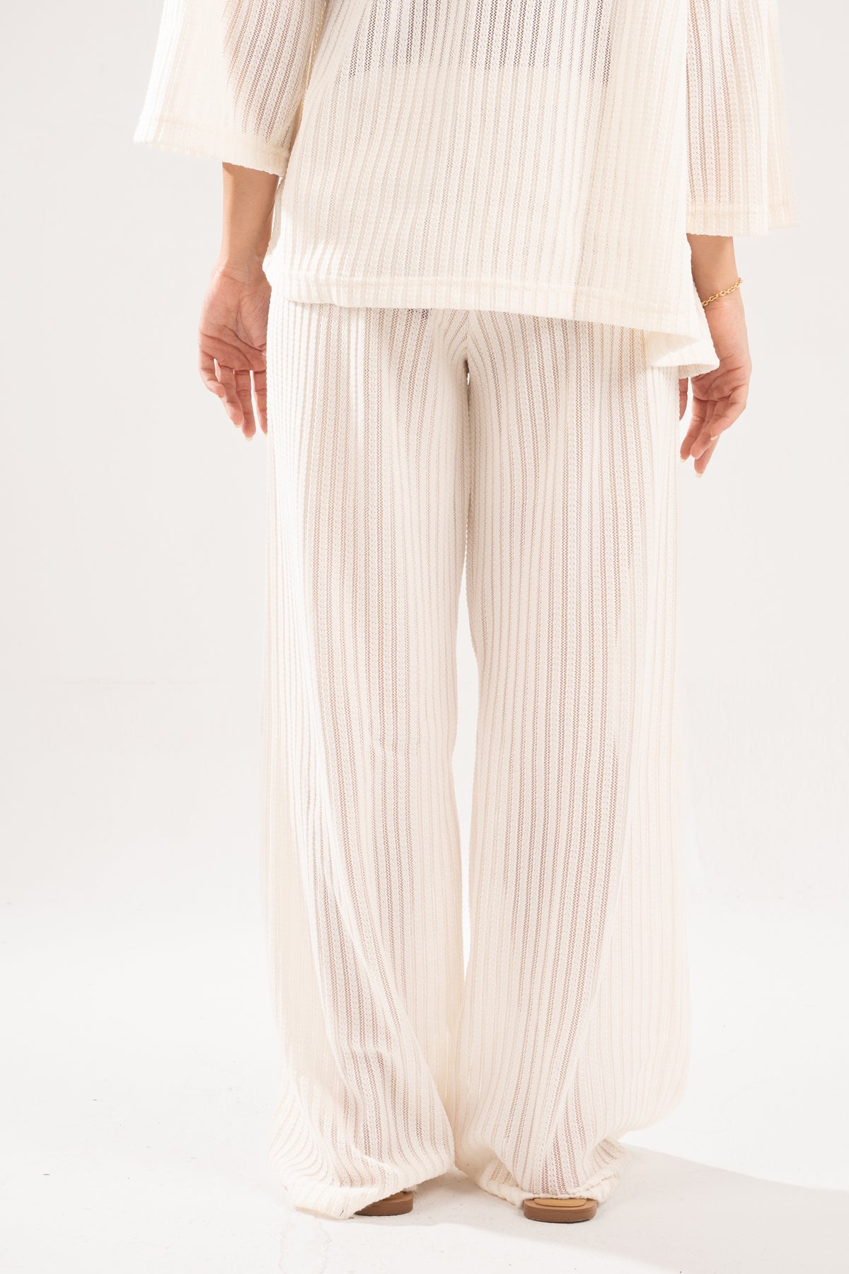 OFF-WHITE SEMI SHEER KNITTED PANTS