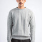 Man wearing a gray knitted sweater on a white background