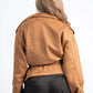 Person wearing a brown jacket on a white background