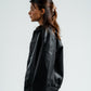 Person wearing a black leather jacket on a white background