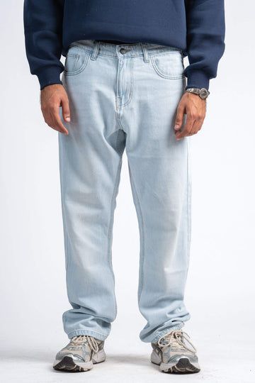 Light blue jeans worn by a person on a white background