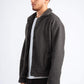 Man wearing a dark gray textured jacket on a white background