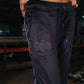 Navy blue pants with a heart design on a blurred background