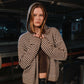 Person wearing a striped hoodie in an indoor setting