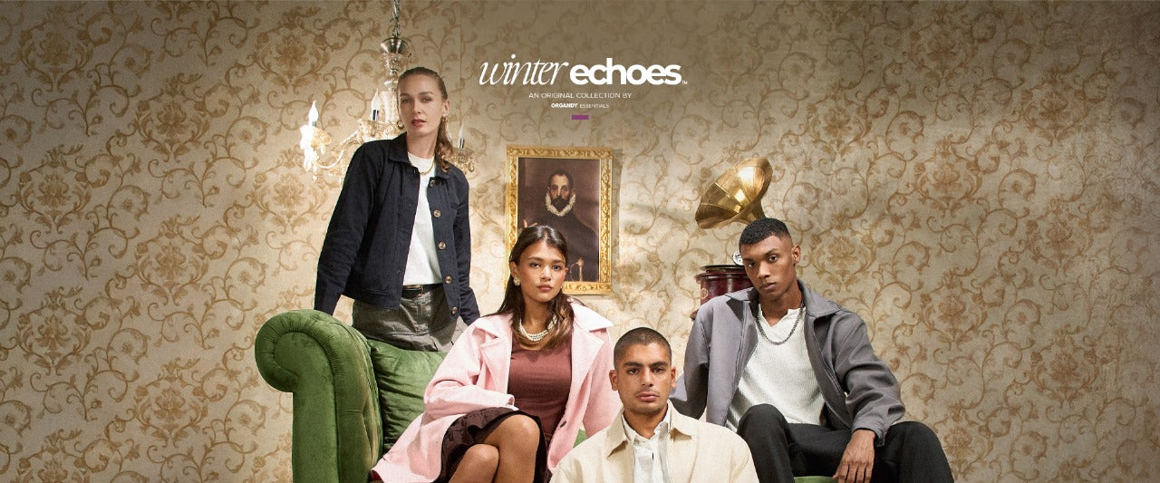 Four people sitting on a green couch in a room with patterned wallpaper and a rug.slider_item_8LKM9H
