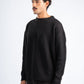 Man wearing a black sweater on a white background
