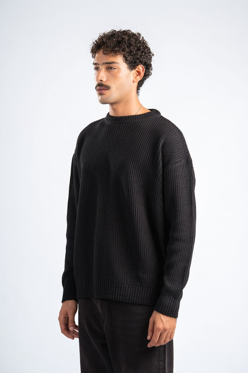 Man wearing a black sweater on a white background